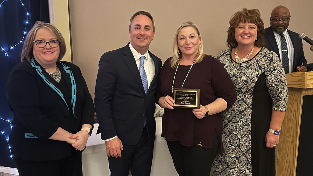 Tina Jensen is awarded the 22-23 School-Related Employee of the Year Award