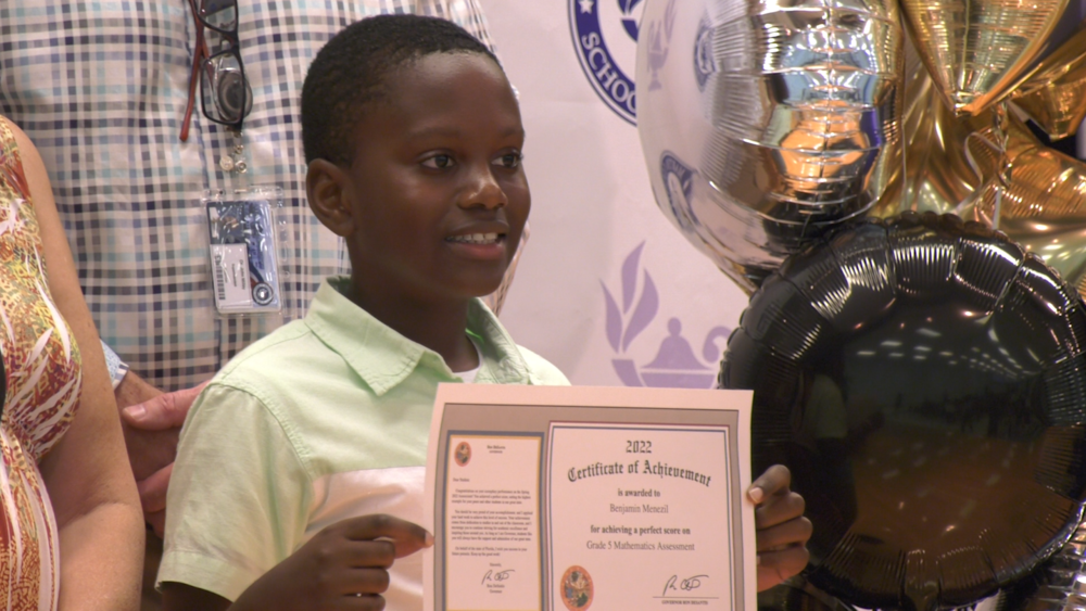 MCSD students accepts Certificate of Achievement for Earning Perfect Score