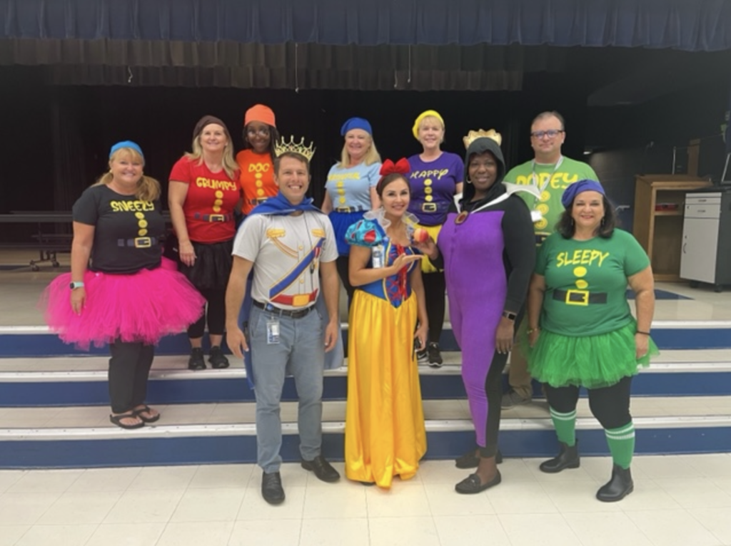 FAWE admin dress up as Snow White and the 7 Dwarfs